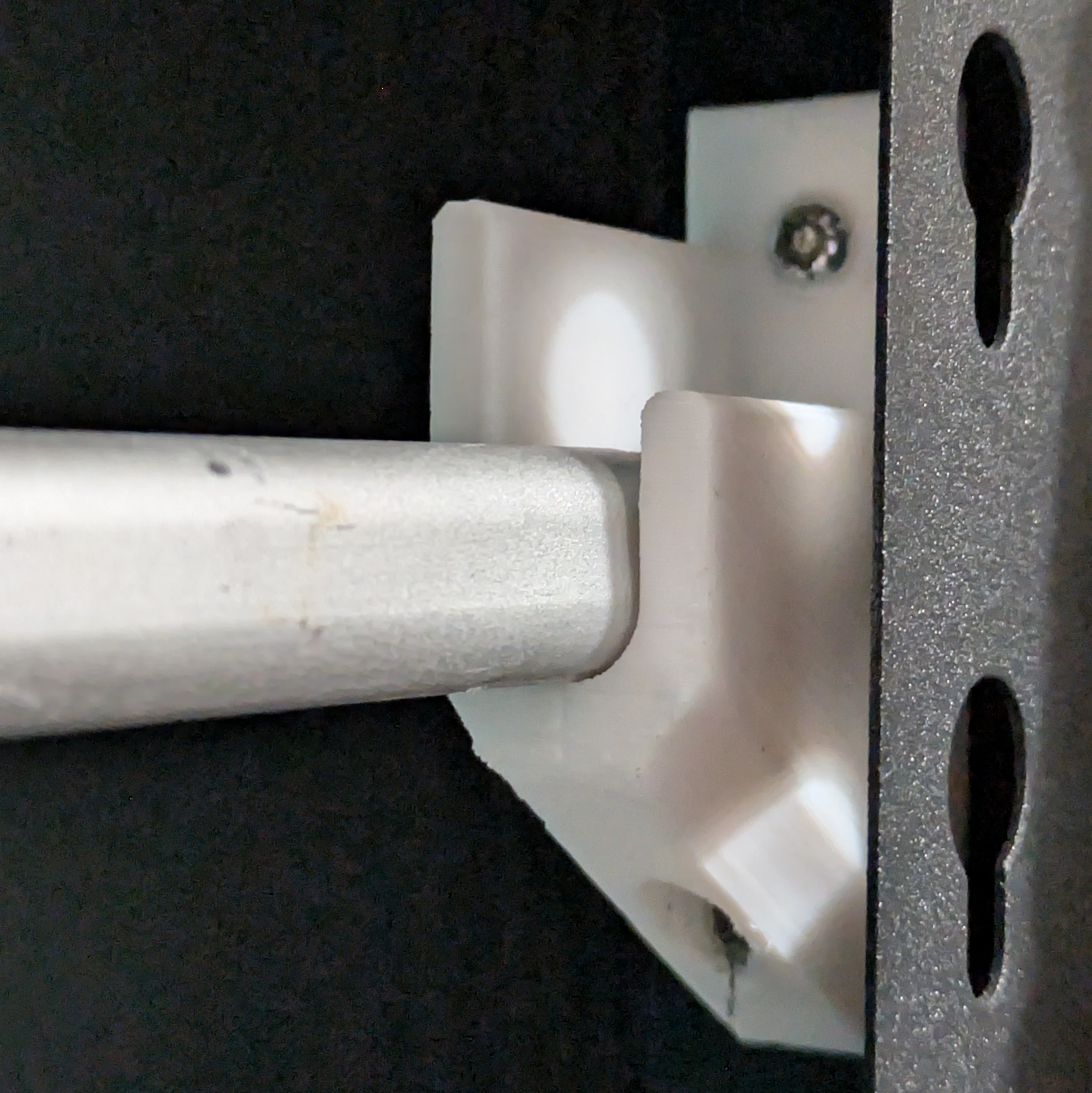 Garage rack spool mount