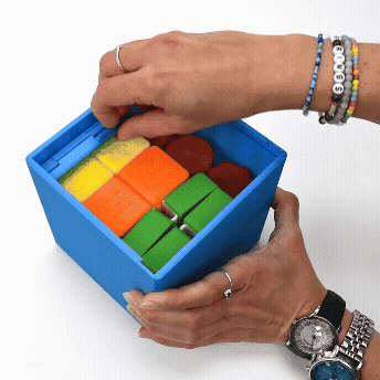 Box for sensory play cubes and rollers