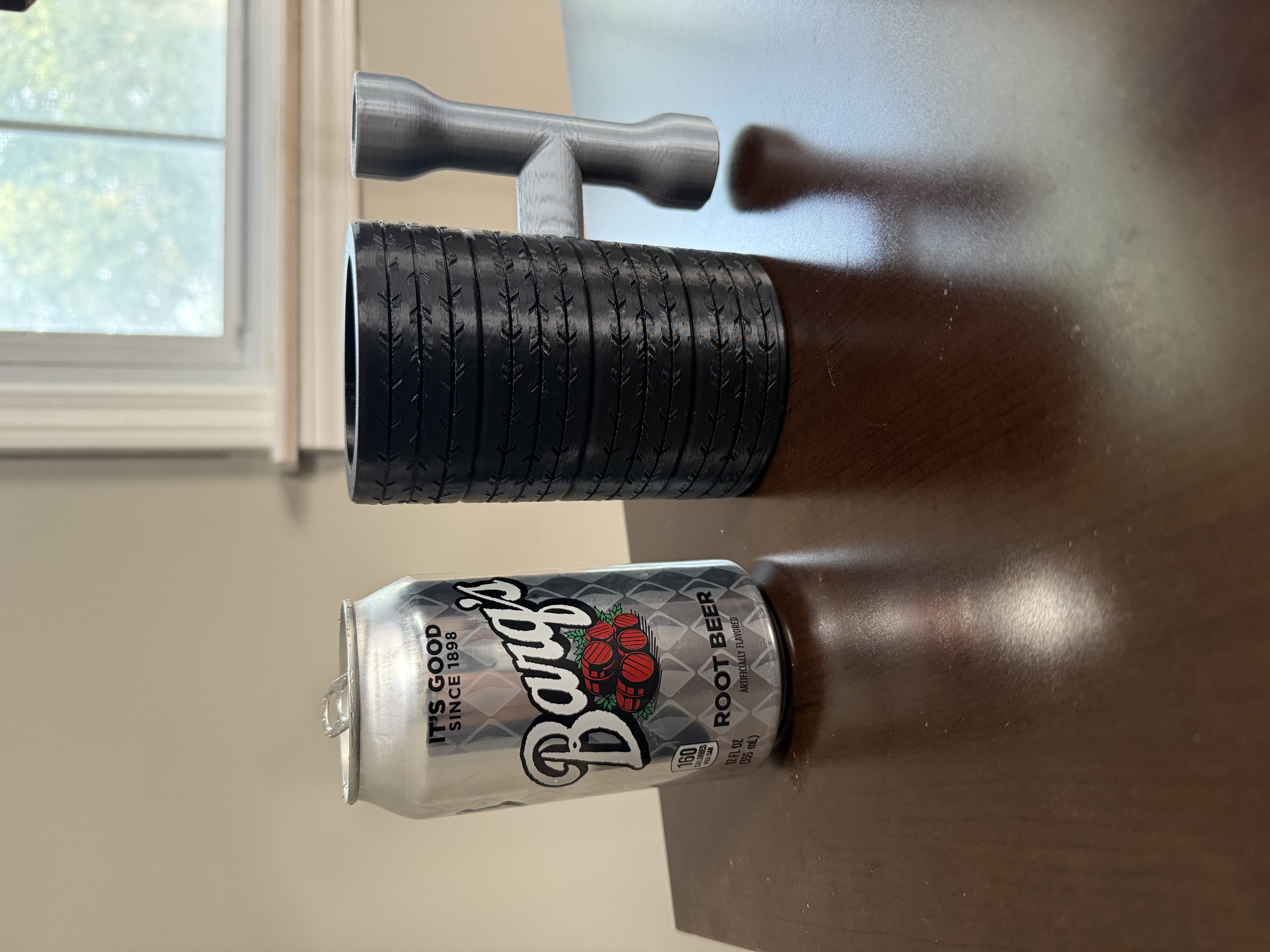Four tires stacked with tire iron can holder