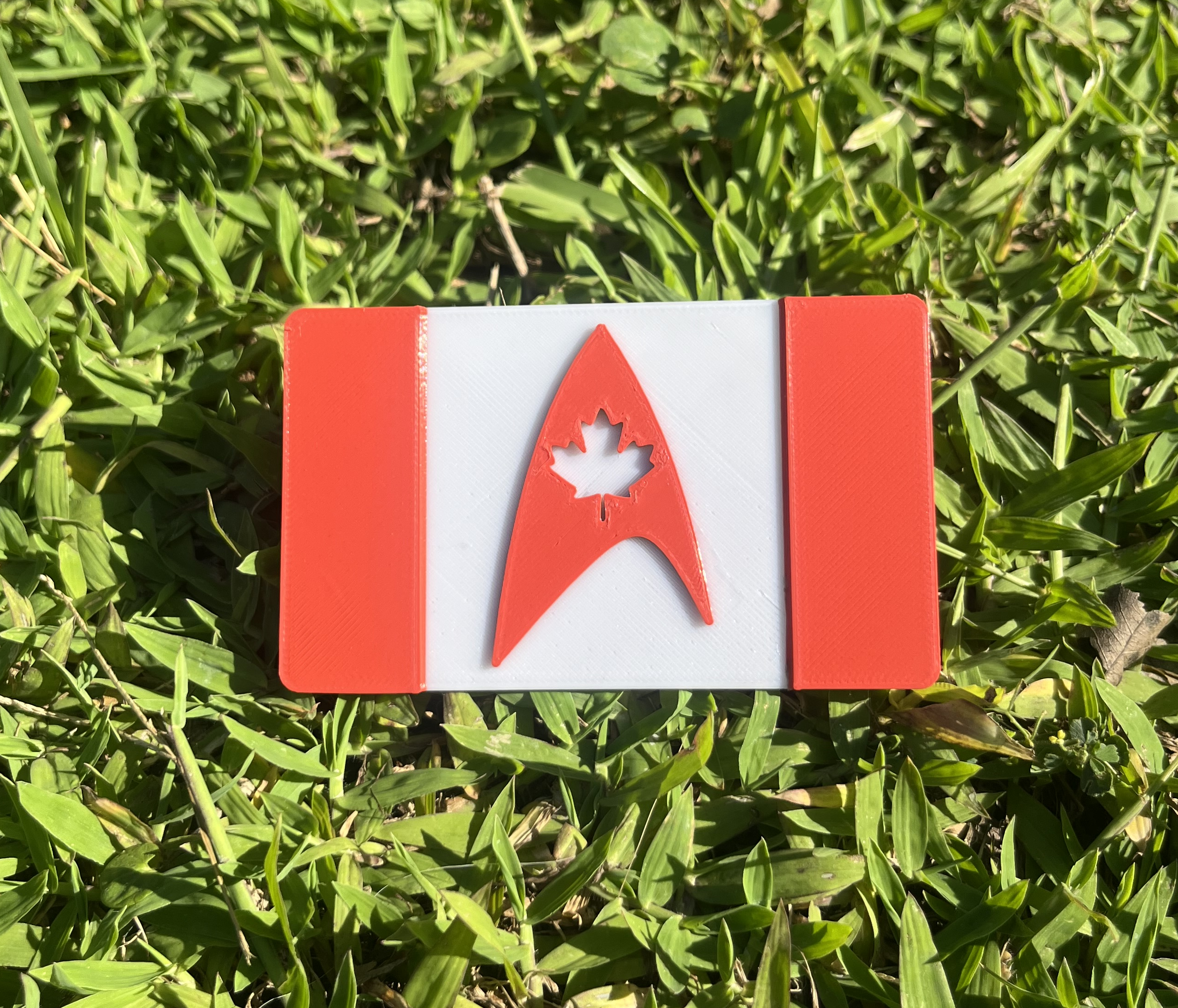 2color Canada flag with the Star Trek Delta Magnet