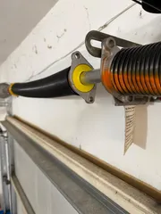 Garage door torsion spring bushing