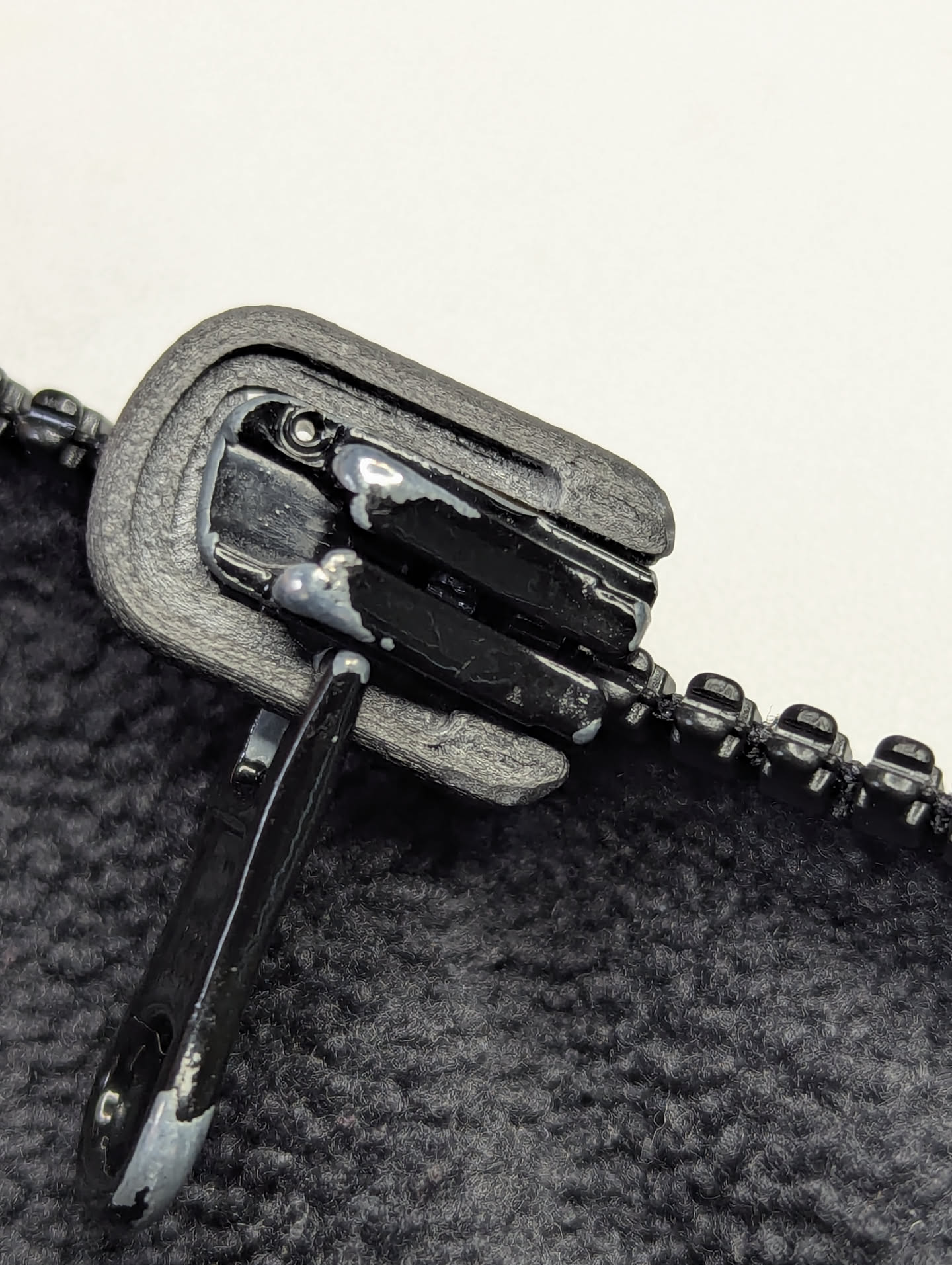 Replacement slider bail (bridge) for auto-lock zipper sliders.