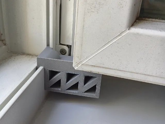 Window holder; in the photo, the printed version looks bigger because I refined the 3D model