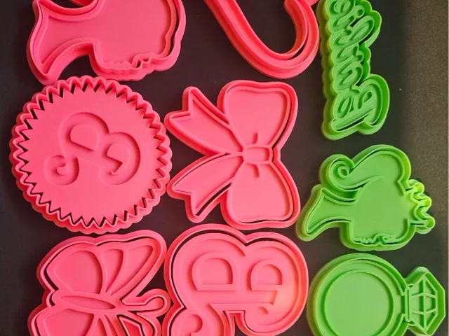 set of 10 barbie cookie cutters and stamps.