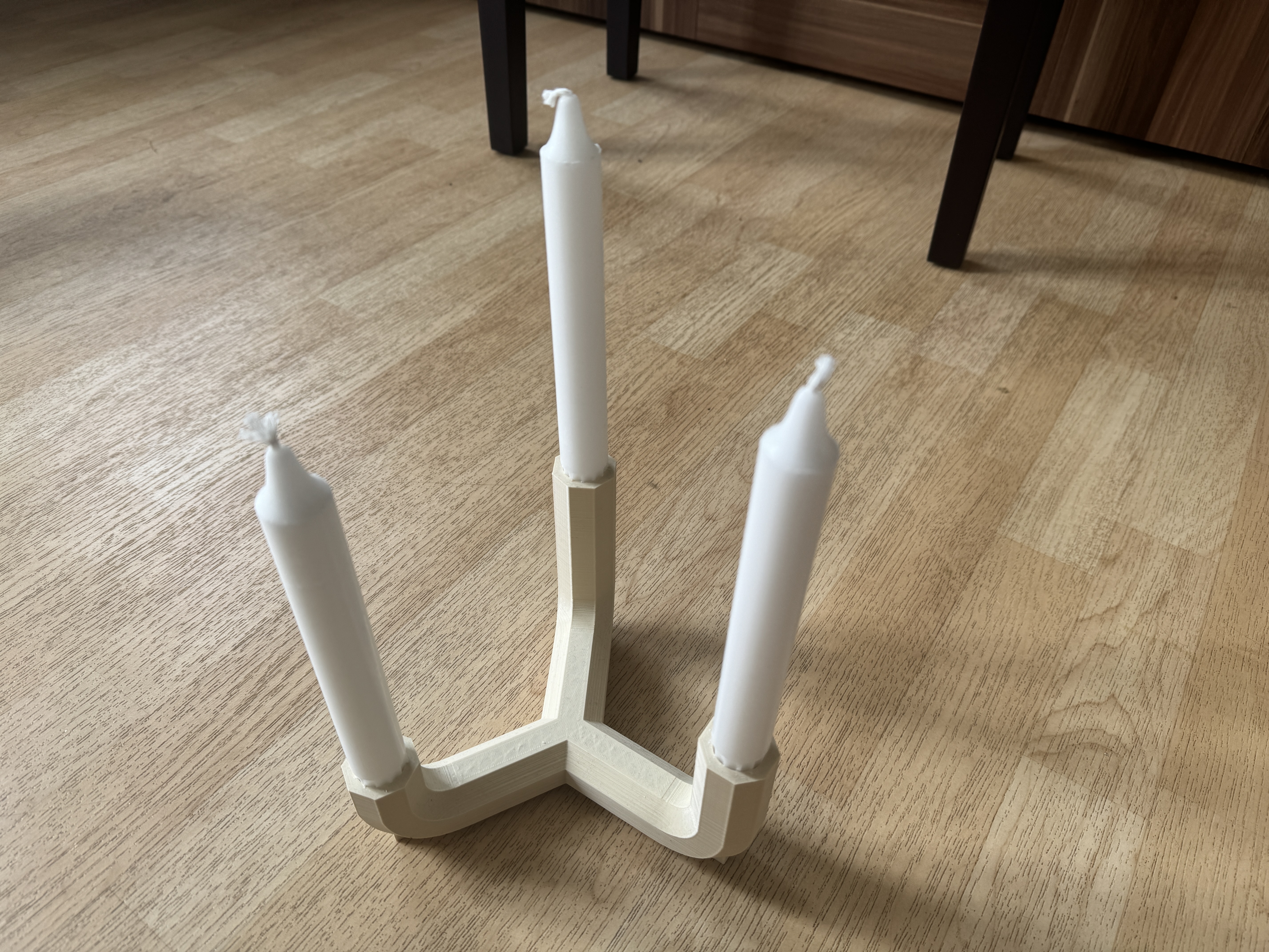 Three-armed candle holder