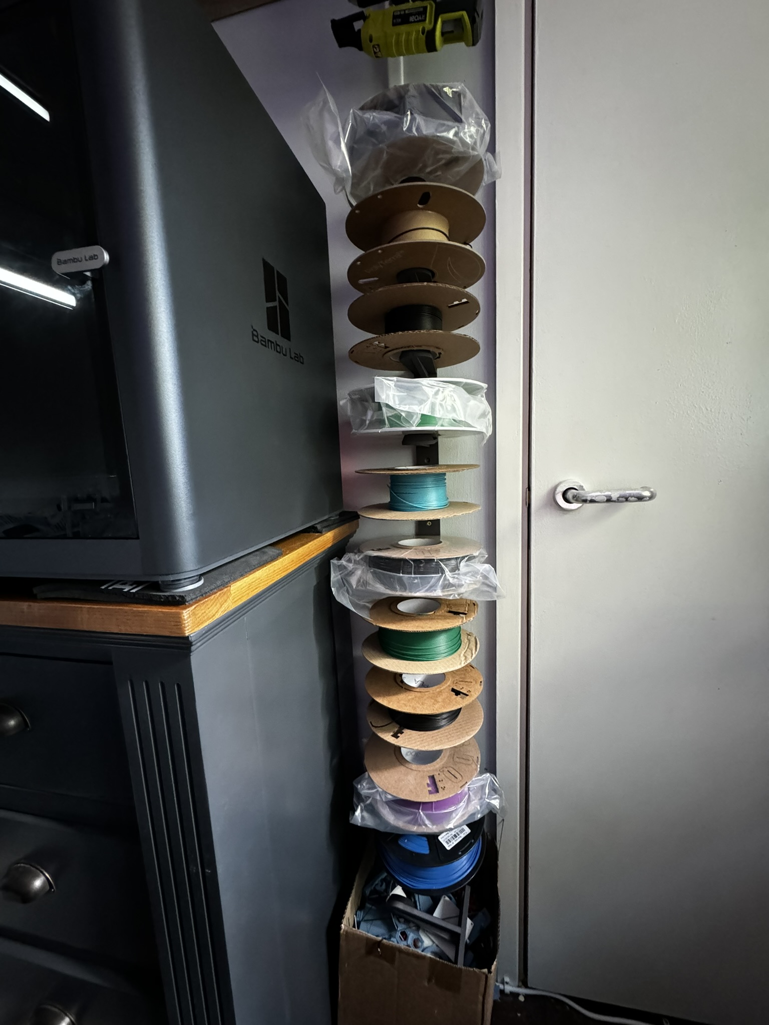 Modular wall-mounted vertical filament roll holder