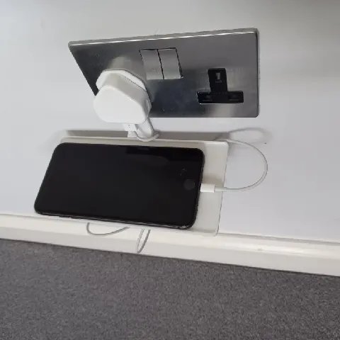 Socket mounted charging shelf