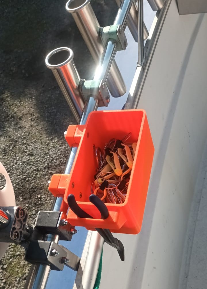 Storage bin for the side rail of fishing boats