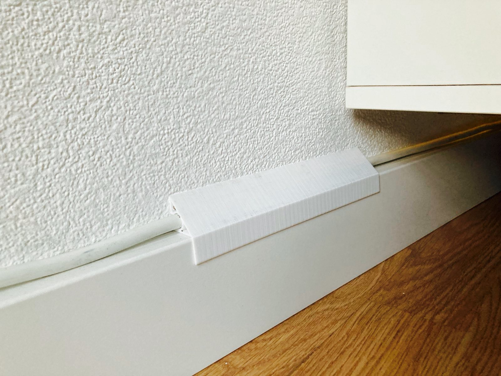 Cable holder for Skirting board