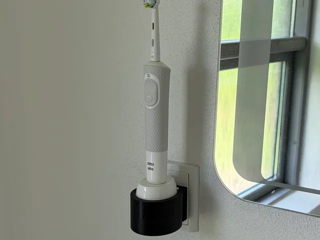 Oral-B  Braun toothbrush mount designed specifically to a Danish power outlet