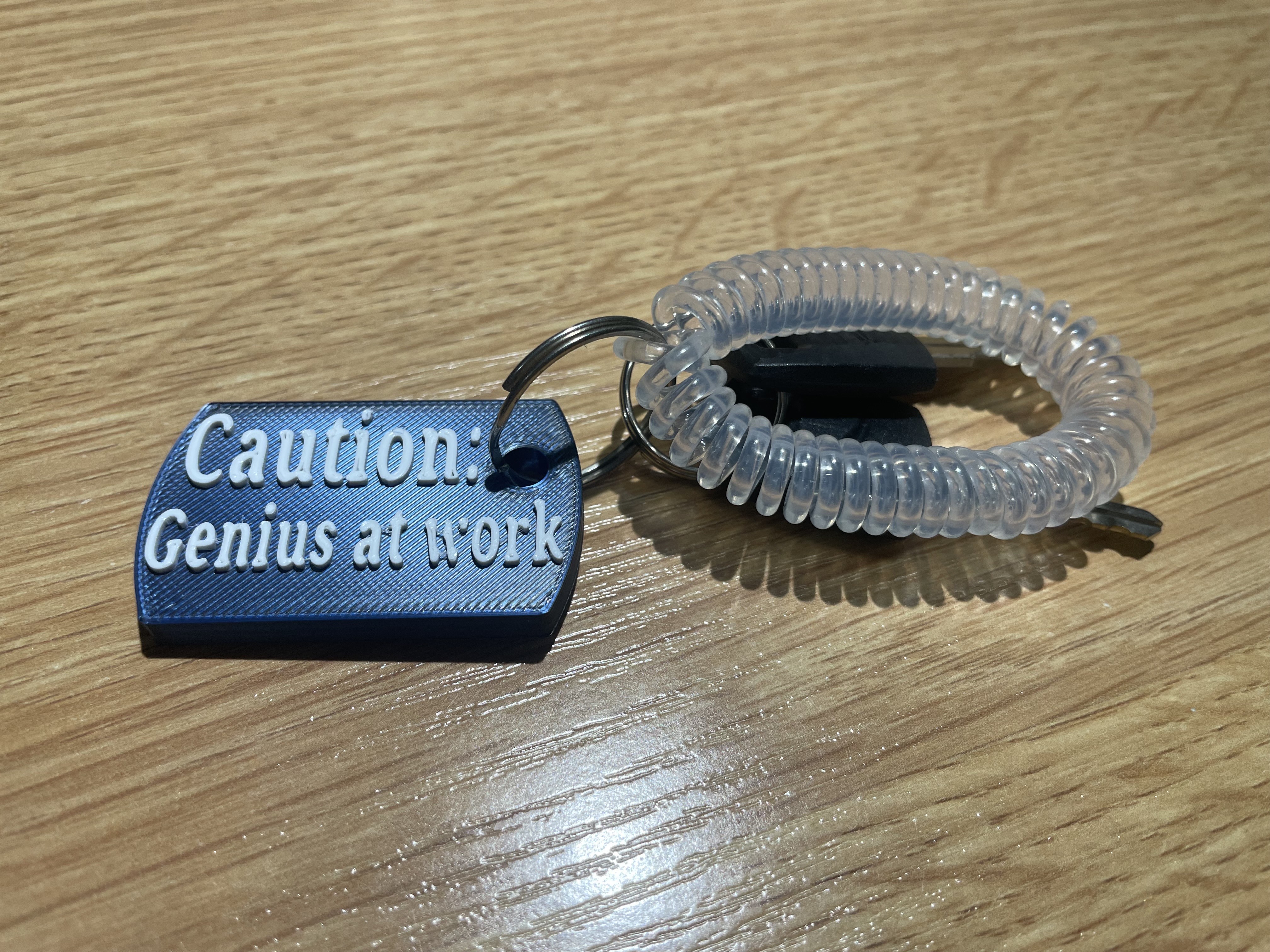 Funny keychain ''Caution: genius at work,,