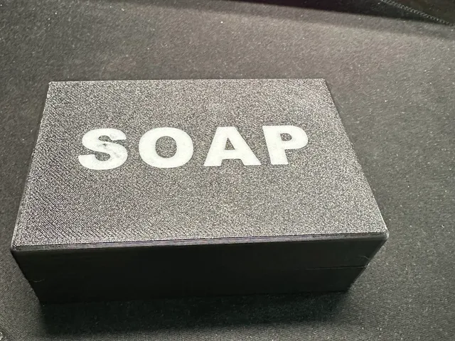 Travel container for a bar of soap