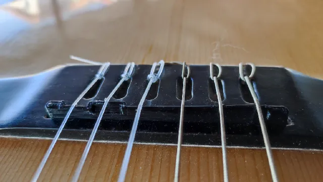 Classic guitar bridge saddle