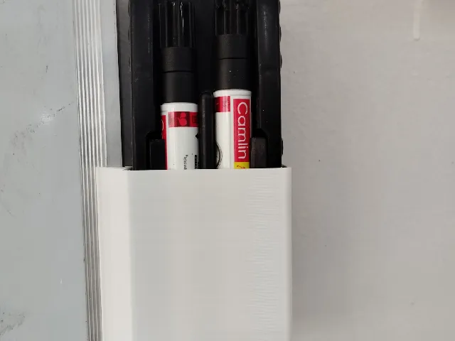 Duster holder Attached to white Board.