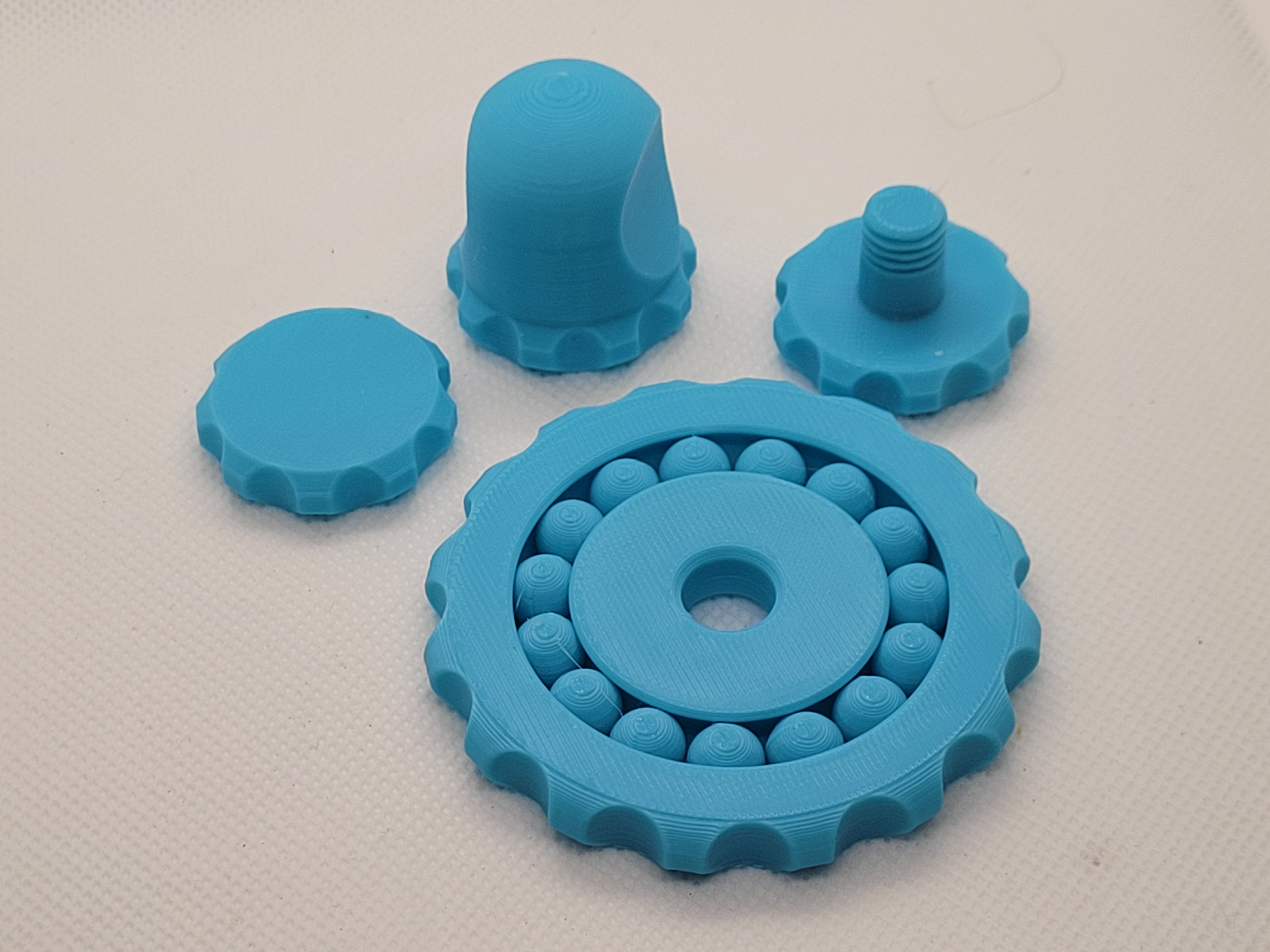 Integrated ball bearing fidget spinner