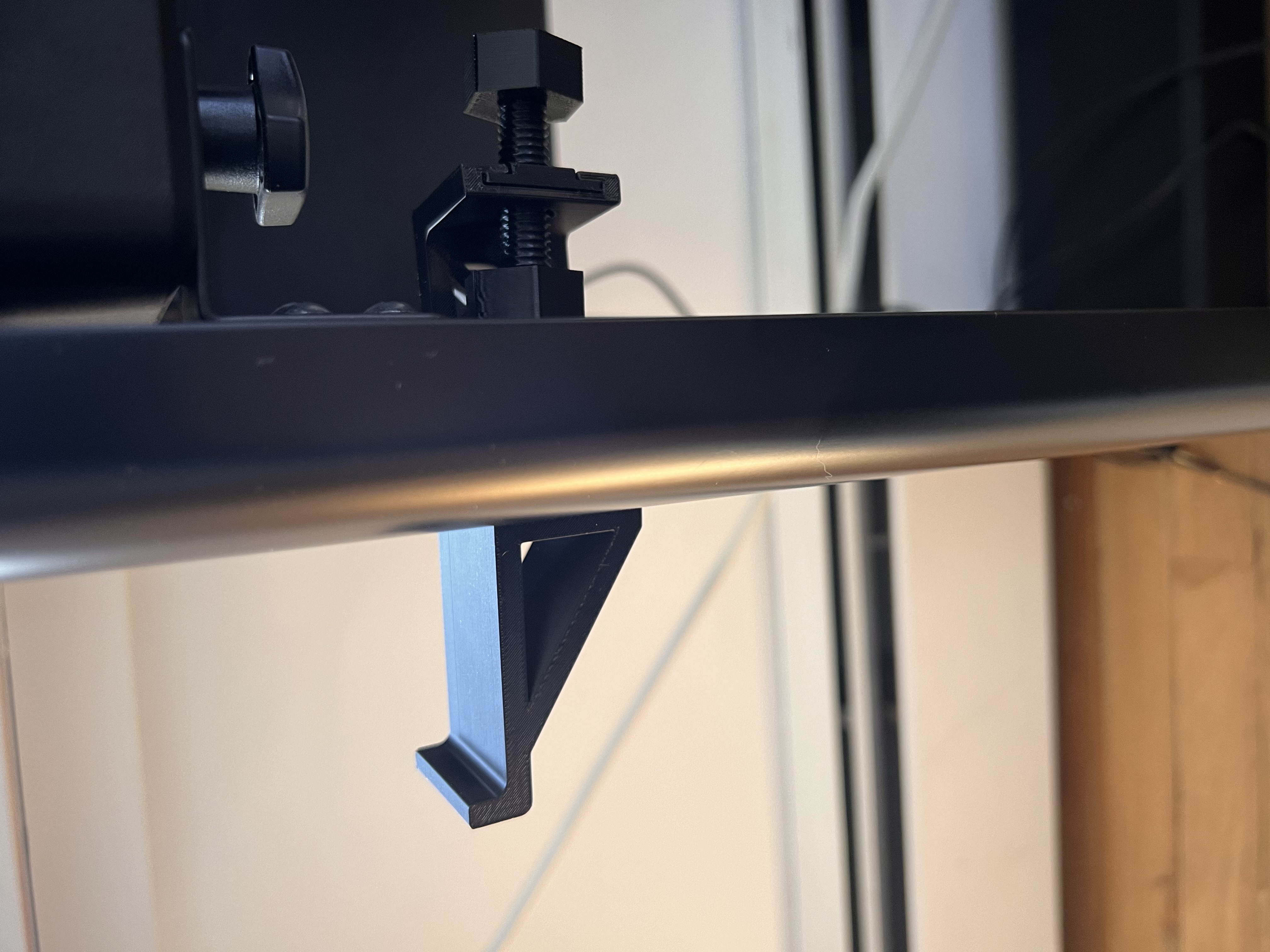 Side mounted headphone hanger