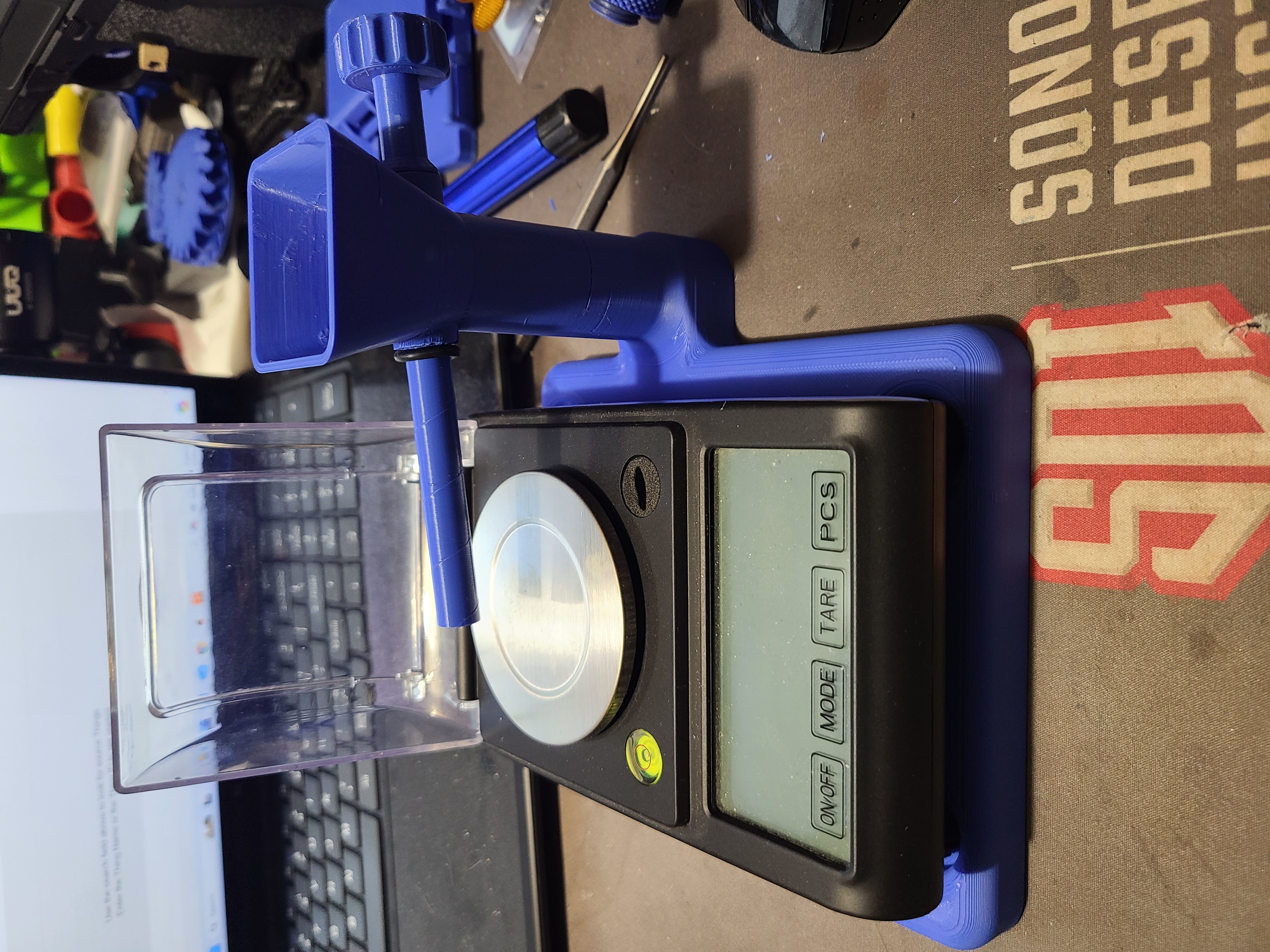 Powder scale base and powder trickler