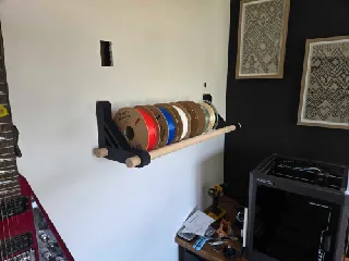 Bracket for wall hung filament rack