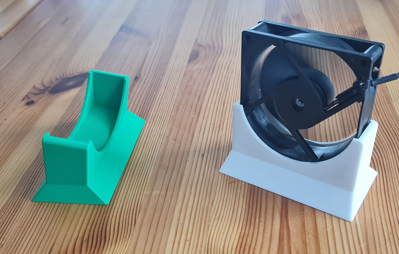 Fan holder. For use as a mobile desktop fan.