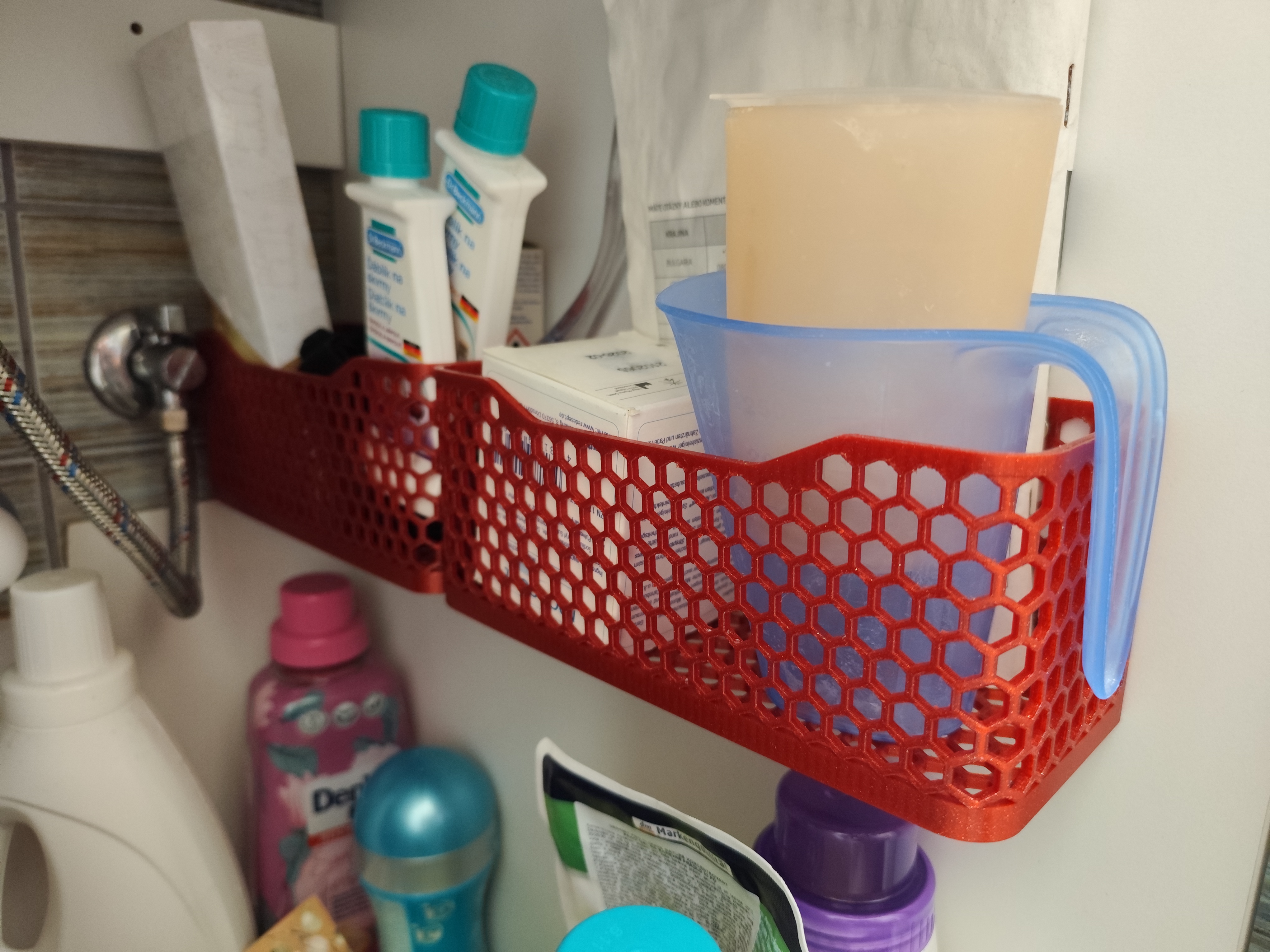 Basket with hexagonal hole pattern, wall mountable