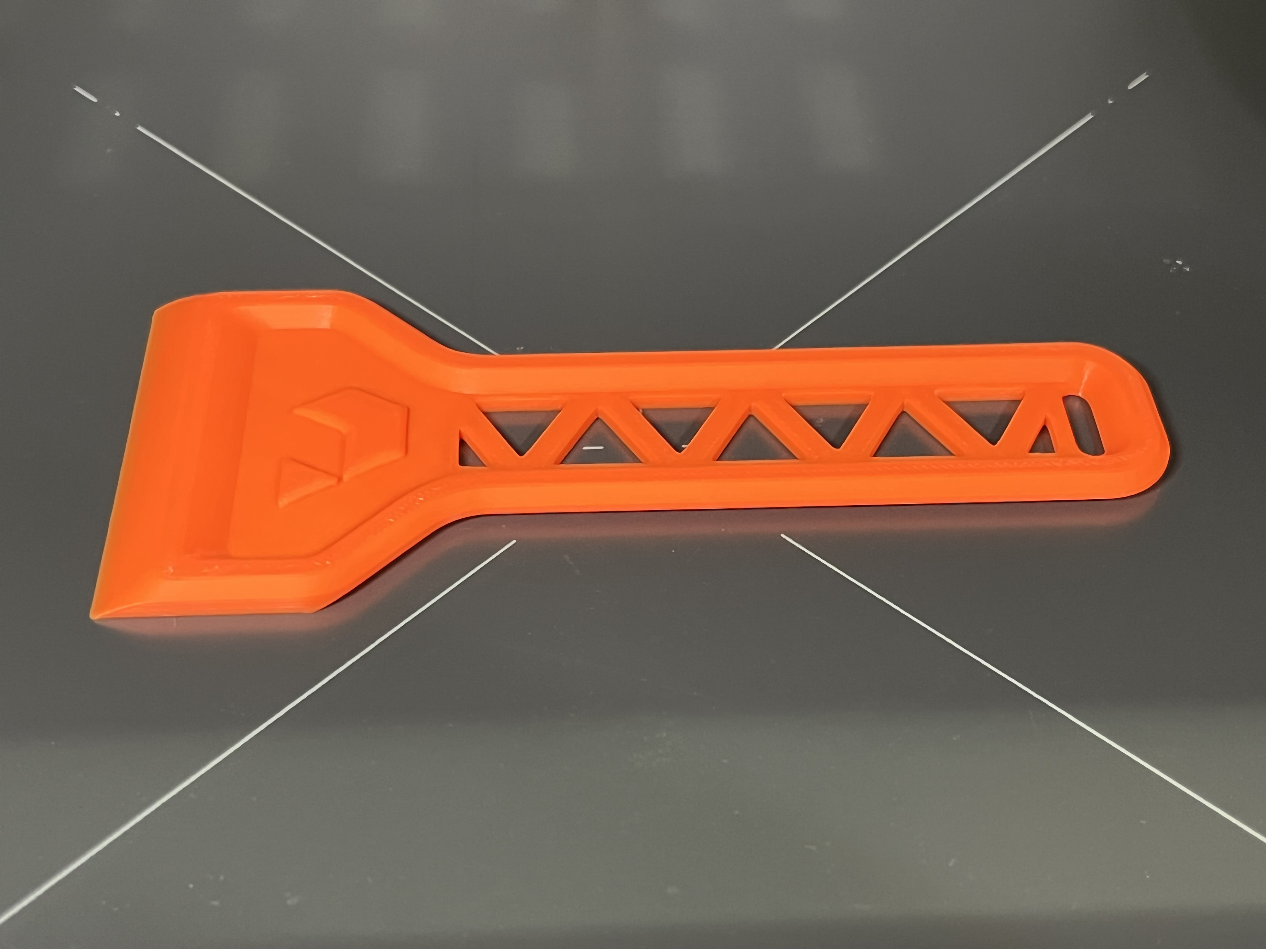 Prusa Spatula Remix + nozzle wiping on underside. Printbed scraper.