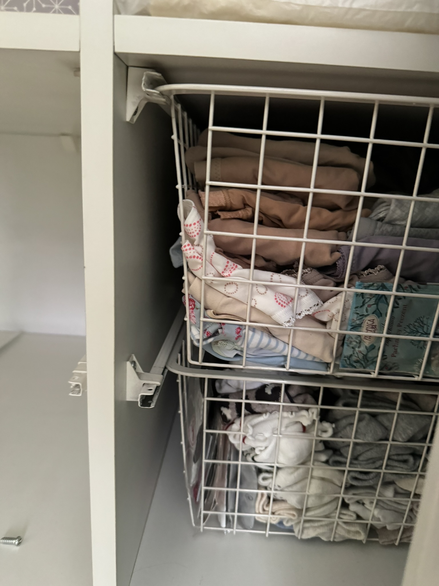 Elfa rails support for metal clothes basket