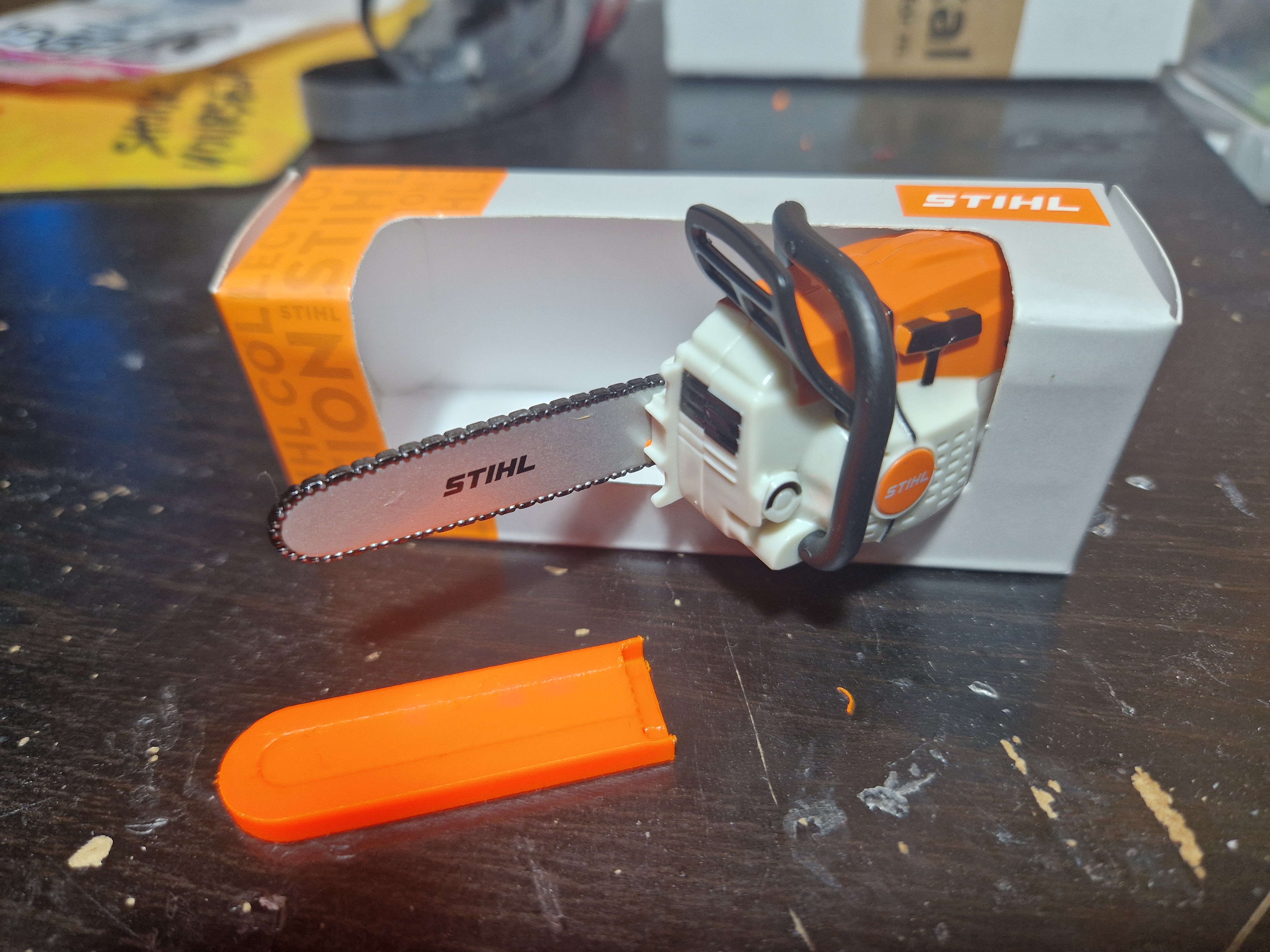 Scale scabbard for STIHL promotional chainsaw