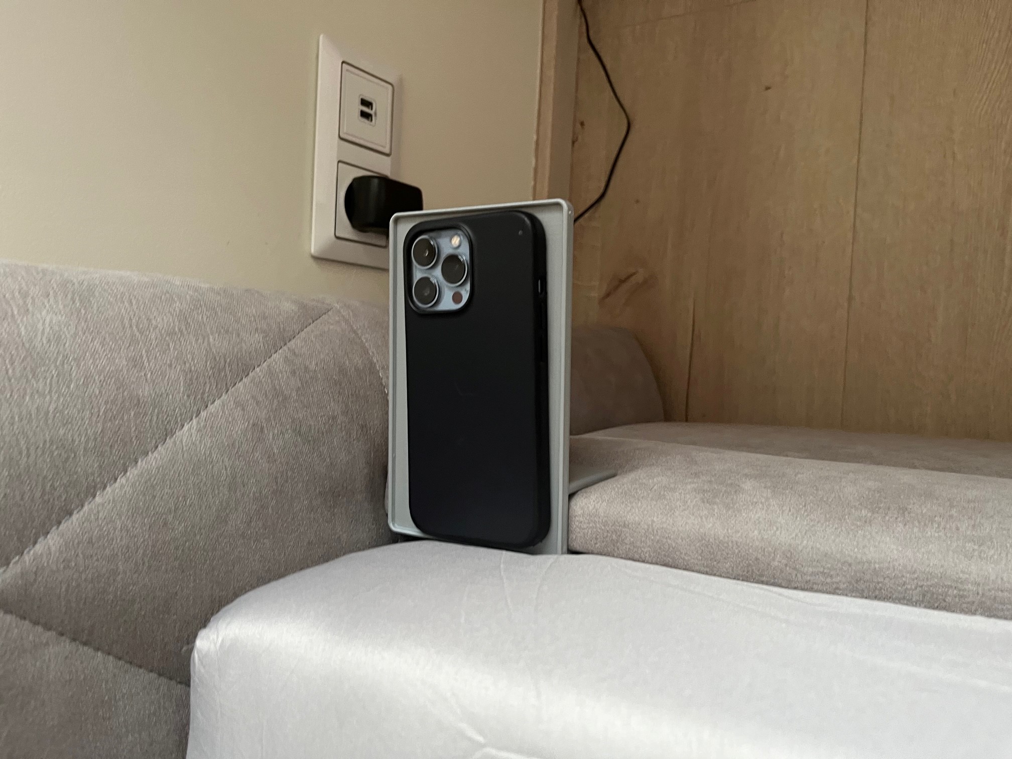 Phone holder on the side of the bed