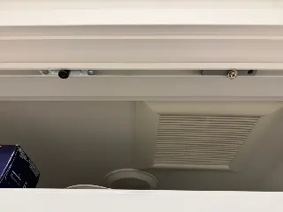 Bifold door top rail bracket