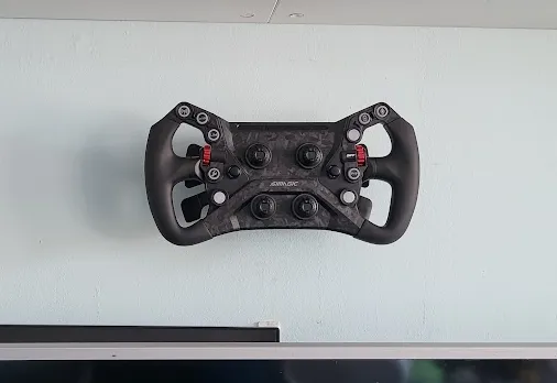 Quick release steering wheel wall mount