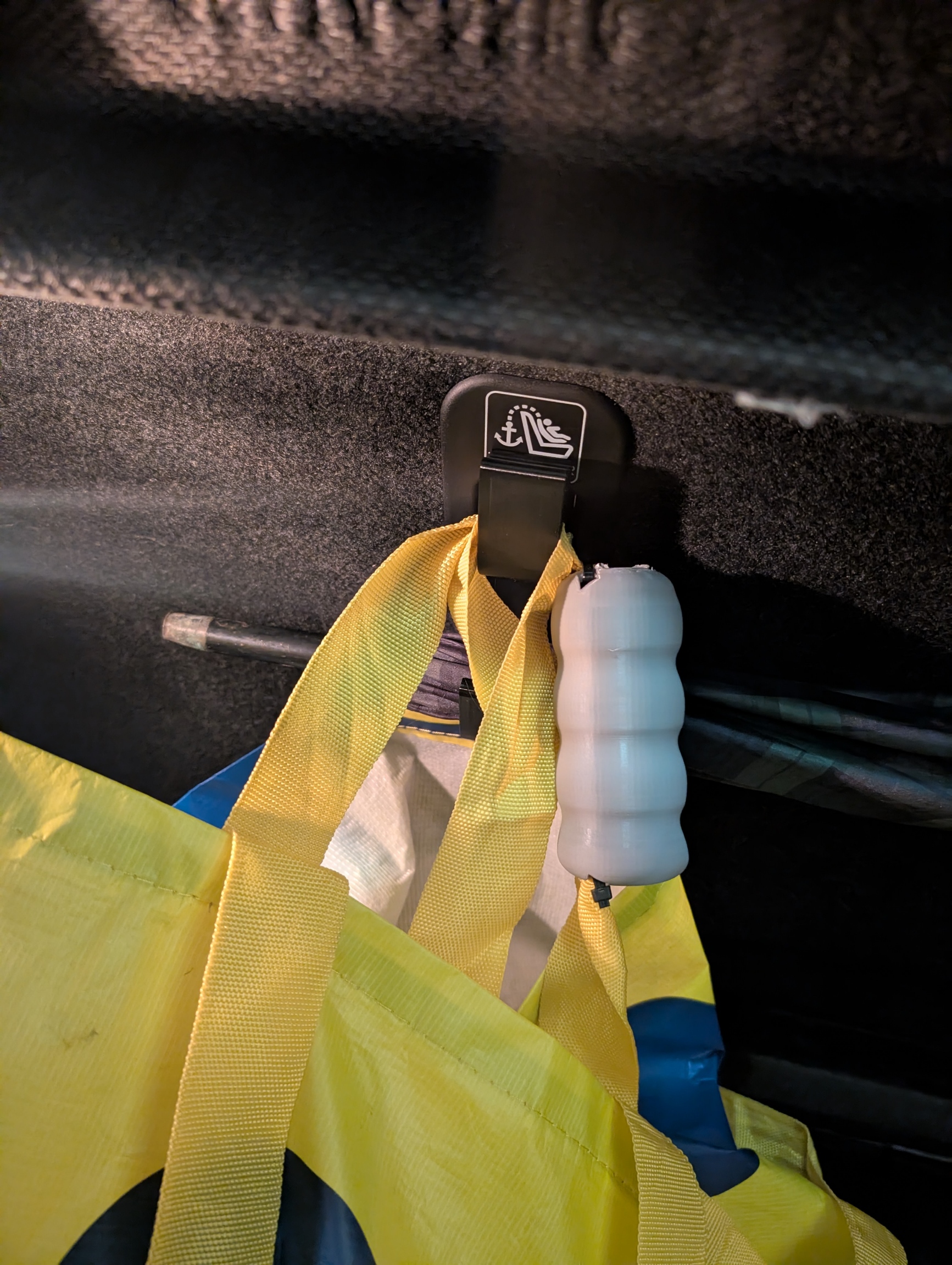 Suzuki Swift Isofix hook for grocery bags, with added umbrella support