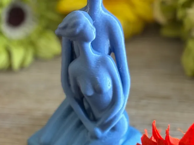 Man and Woman Embracing Figure