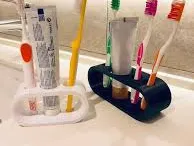 Toothbrush and tothpaste tube holder