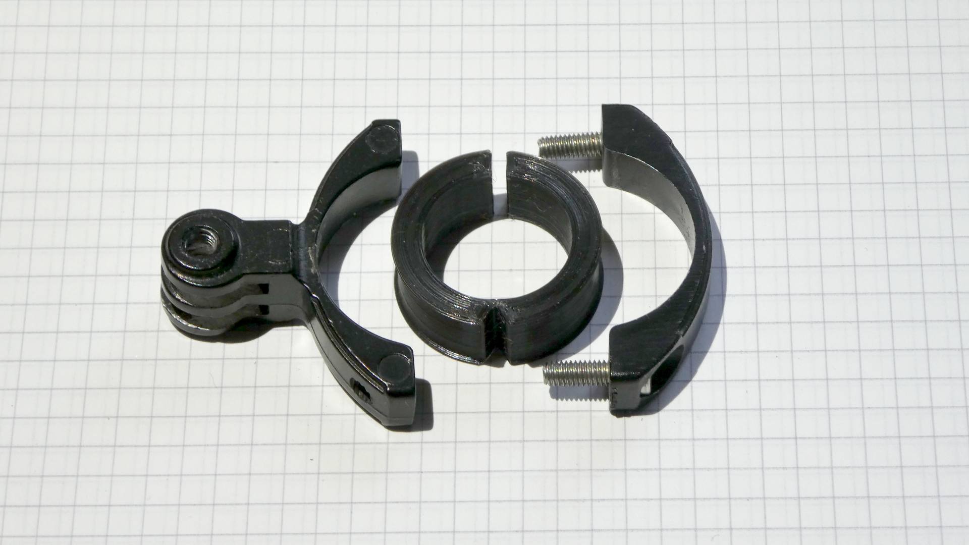 Bike handlebar spacer / adapter for standard camera and flashlight mounts (PETG optimized, FreeCAD parametric).