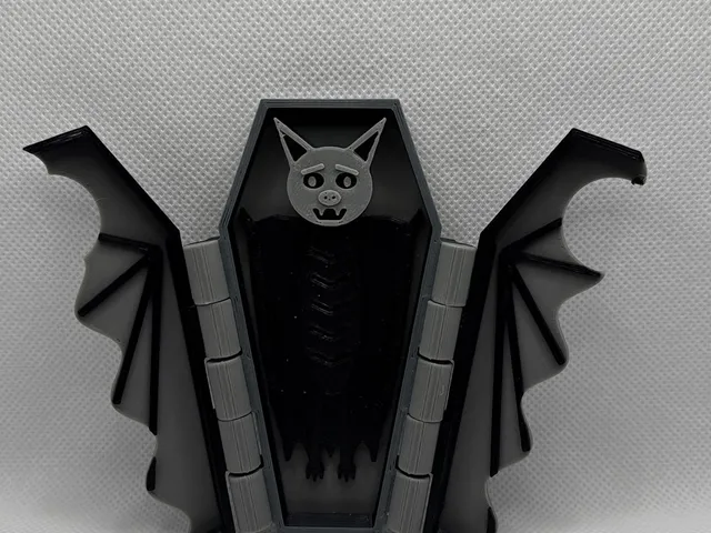 Spooky coffin with vampire bat inside and foldable wings