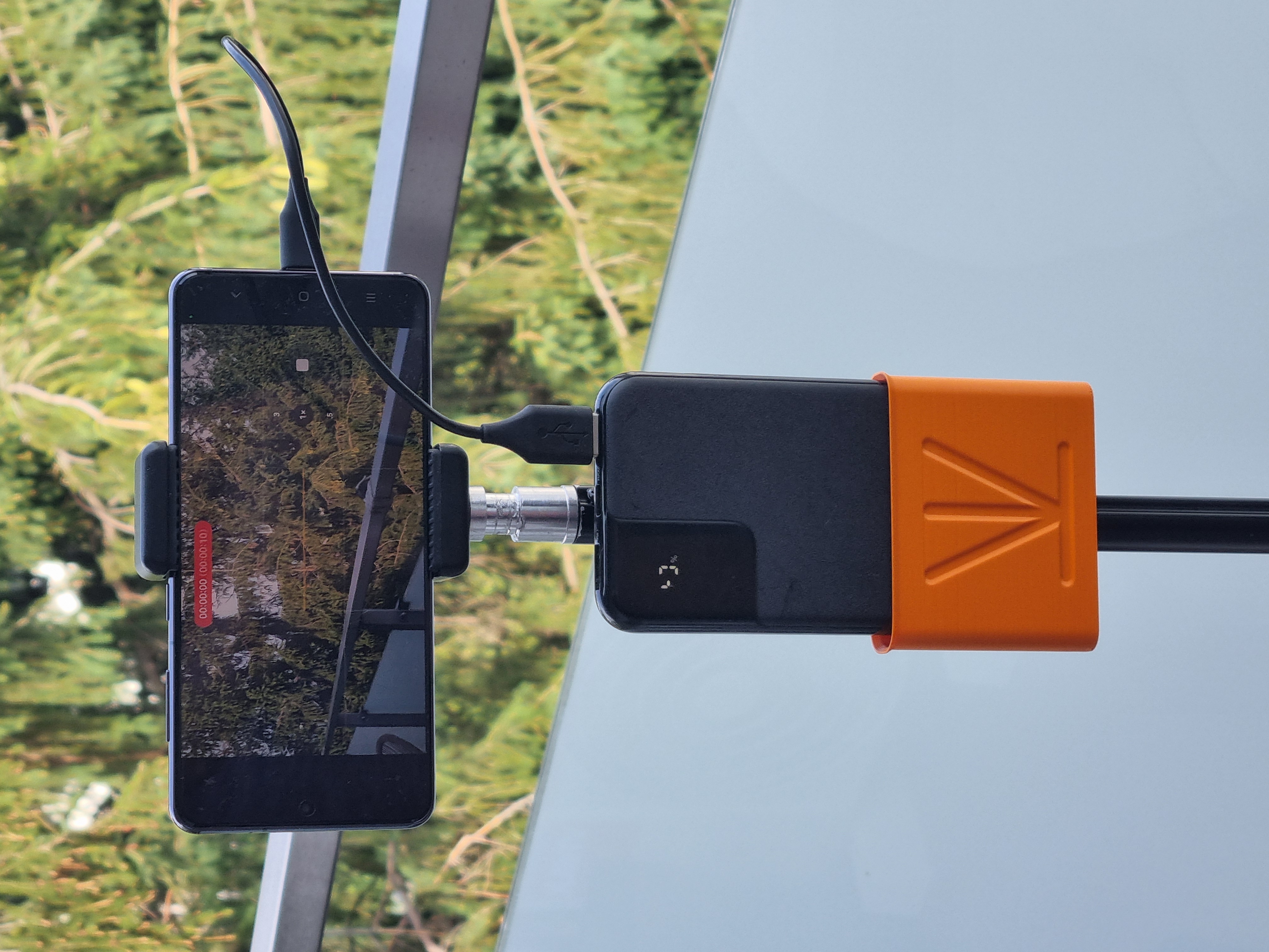 Versatile Snap-On Holder for Power Banks, Remote Controls and others.