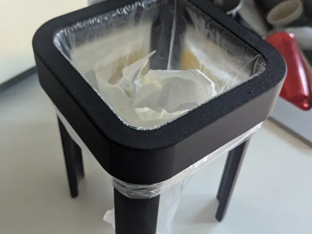 Trash bag holder for surfaces