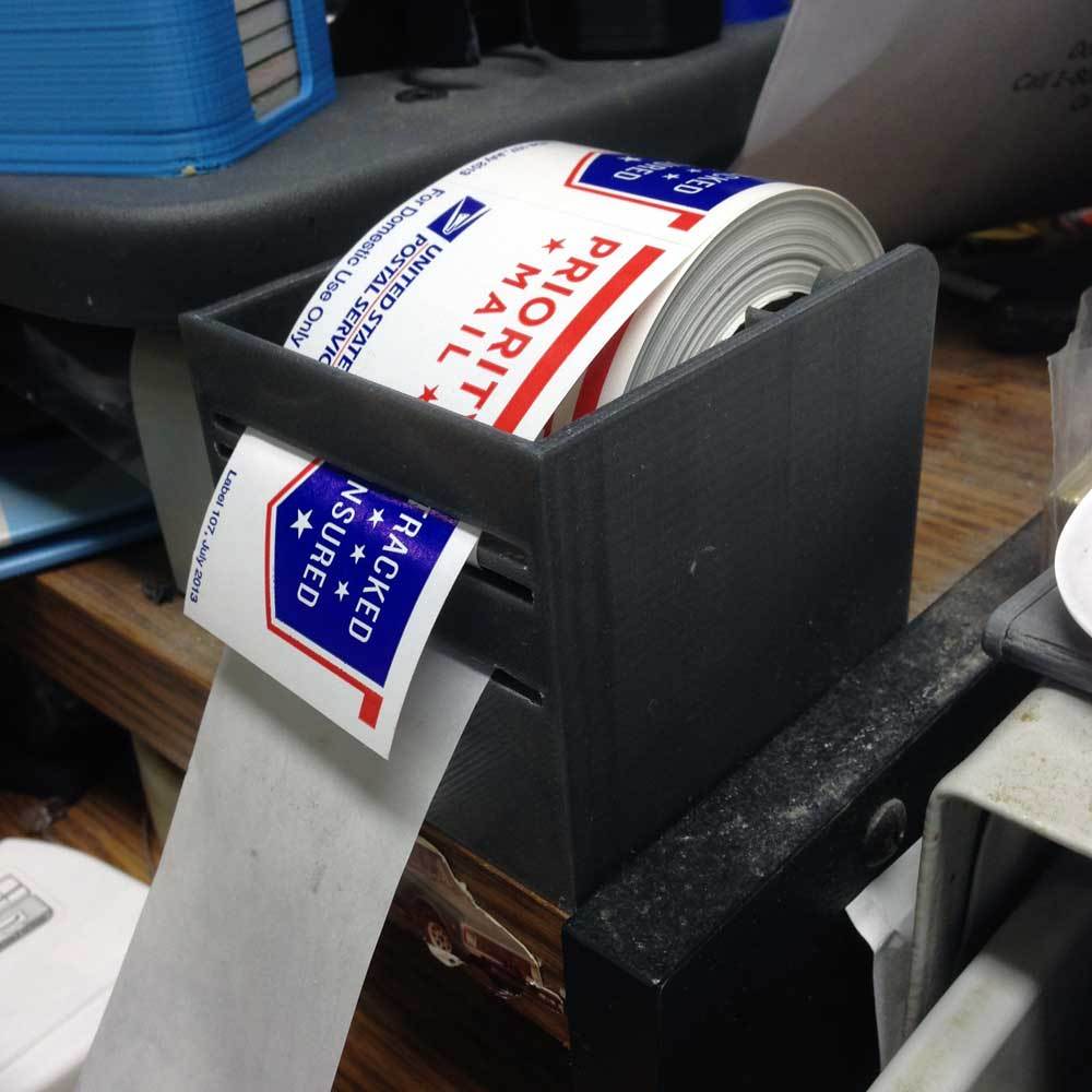 Dispenser for Priority Mail Roll Labels.