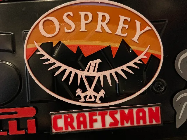 osprey company logo (with sunset behind mountains background)