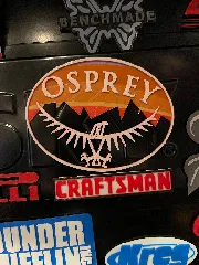 osprey company logo (with sunset behind mountains background)