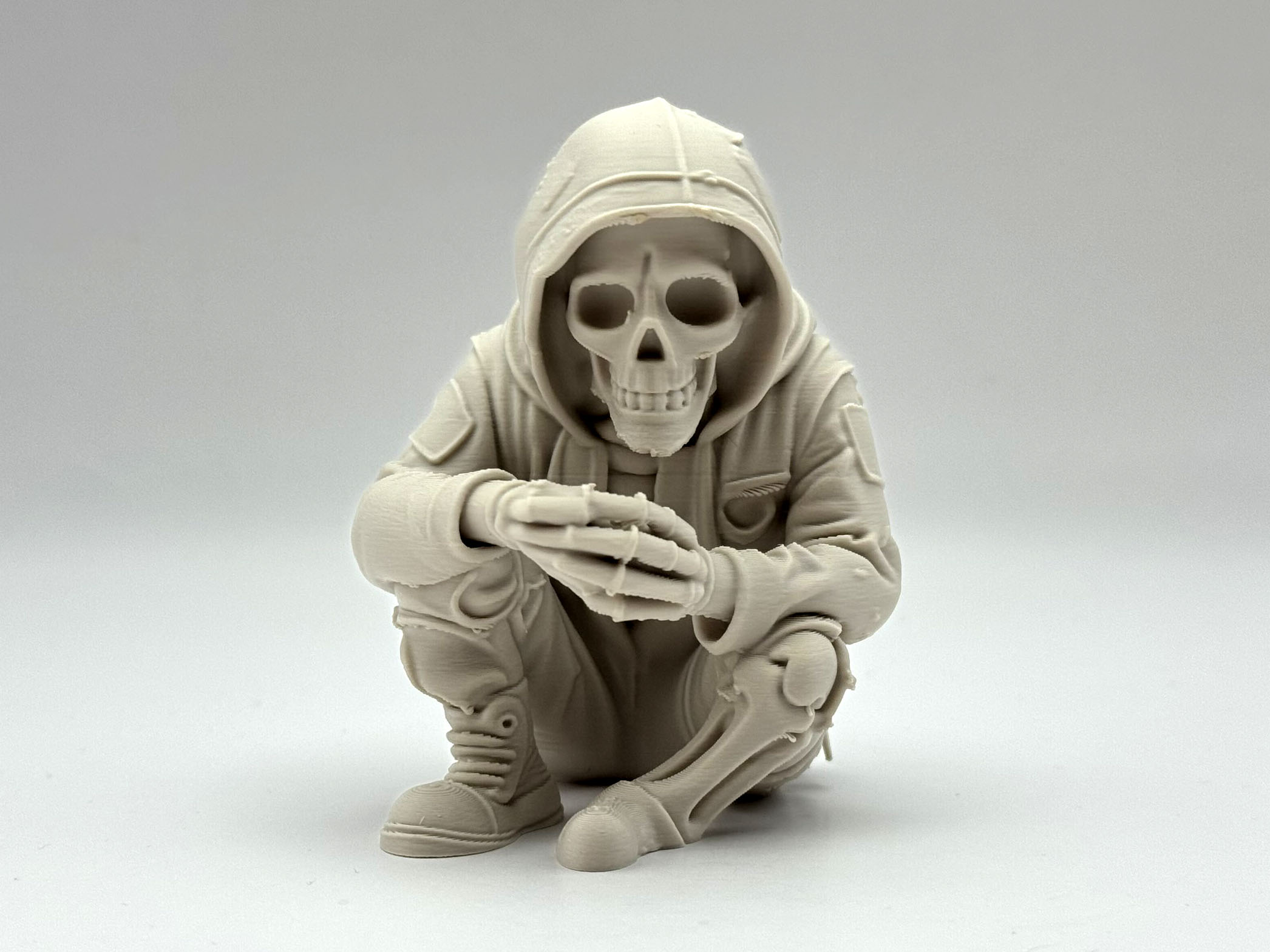Sitting Skeleton in Hoodie