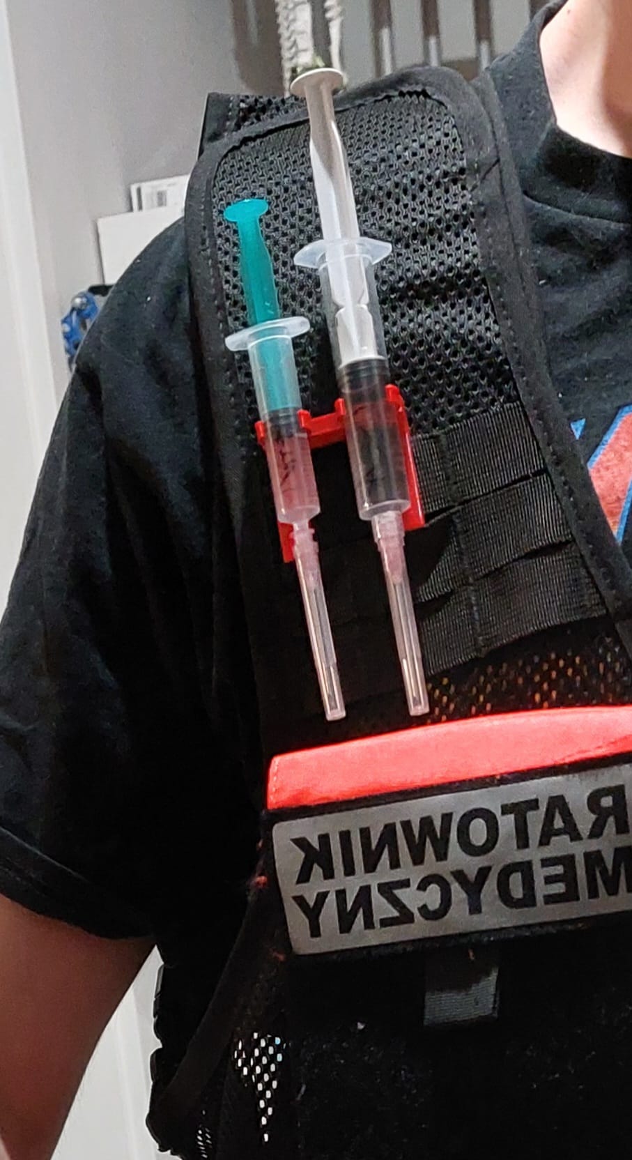 Syringe clip for vests, backpack