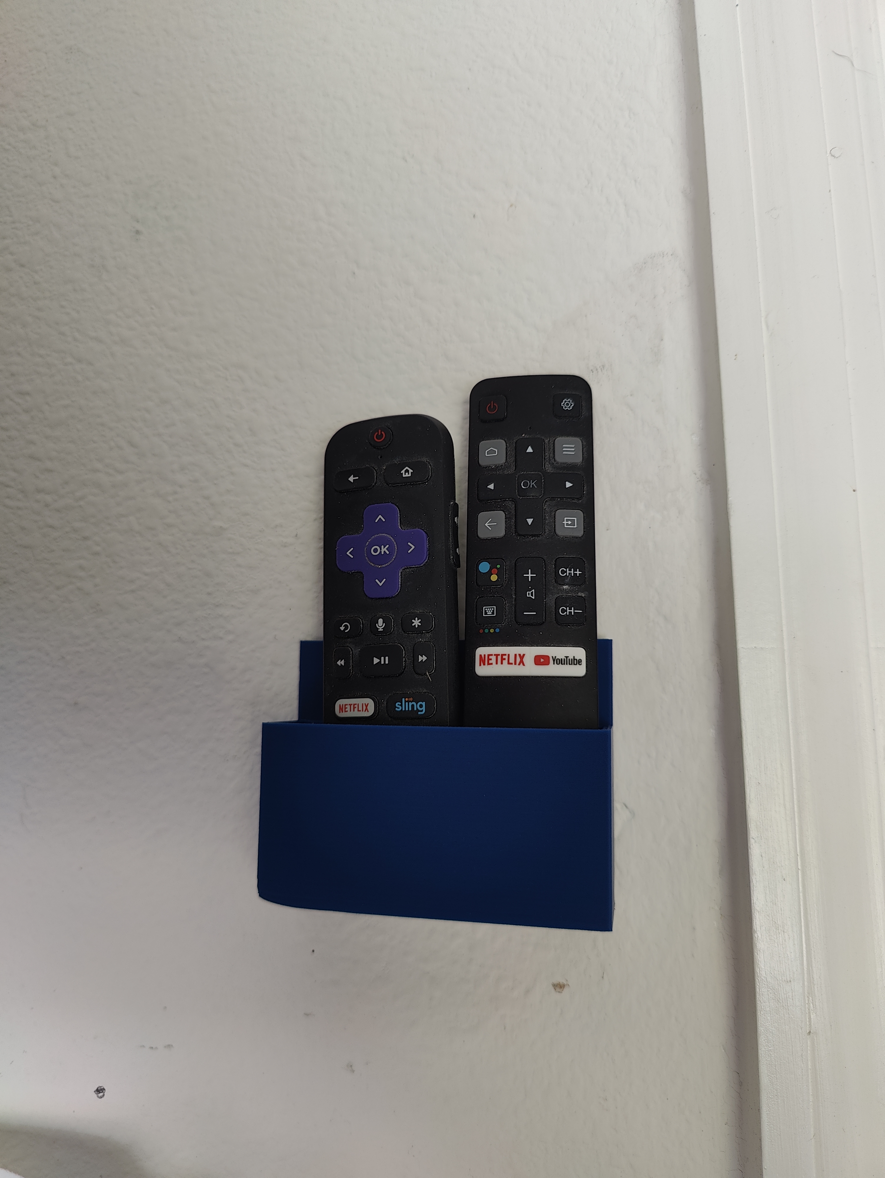 Dual wall mounted remote holder