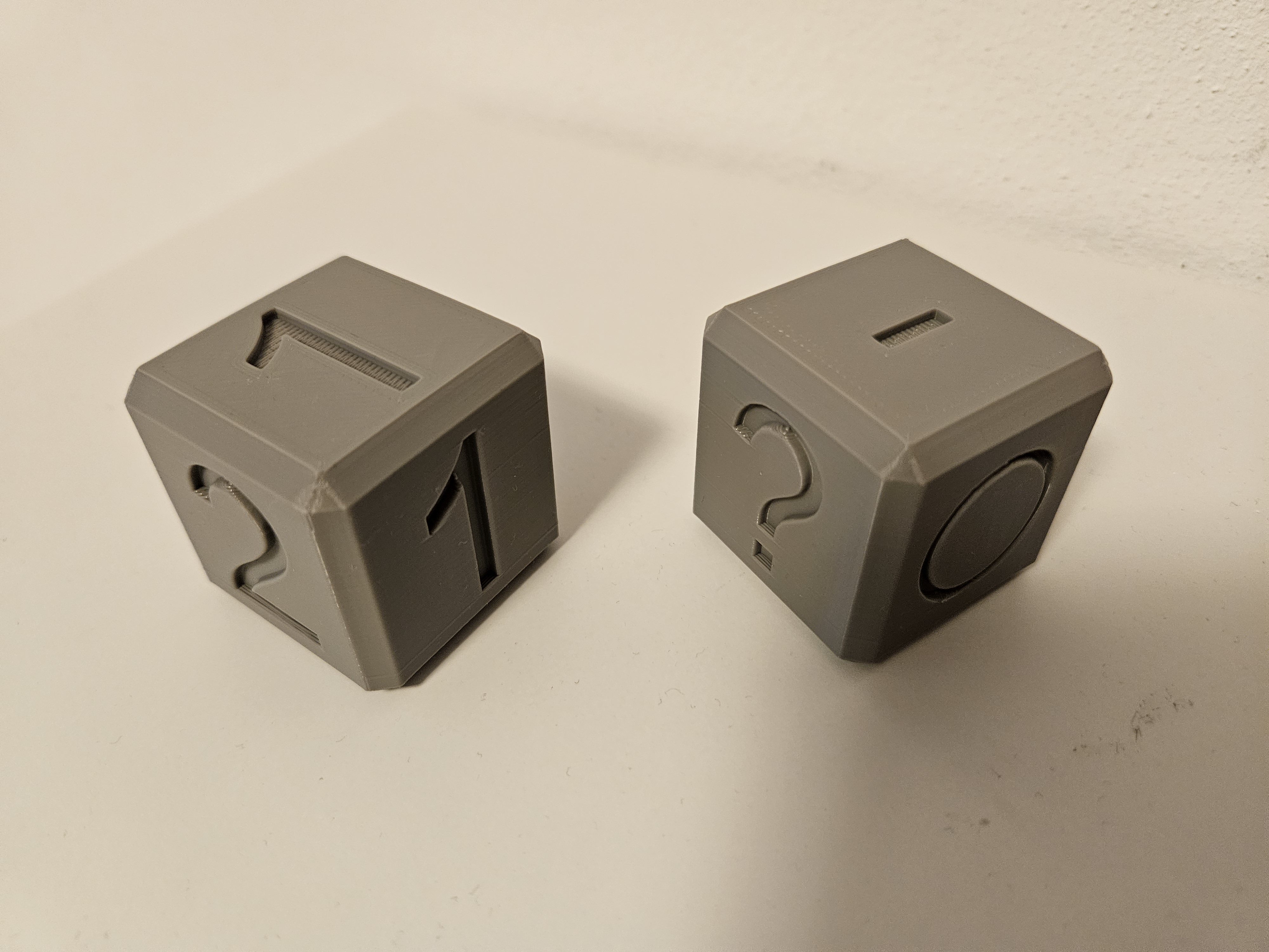 Dice with 1 and 2, and dice with circle, line, rectangle and question mark -