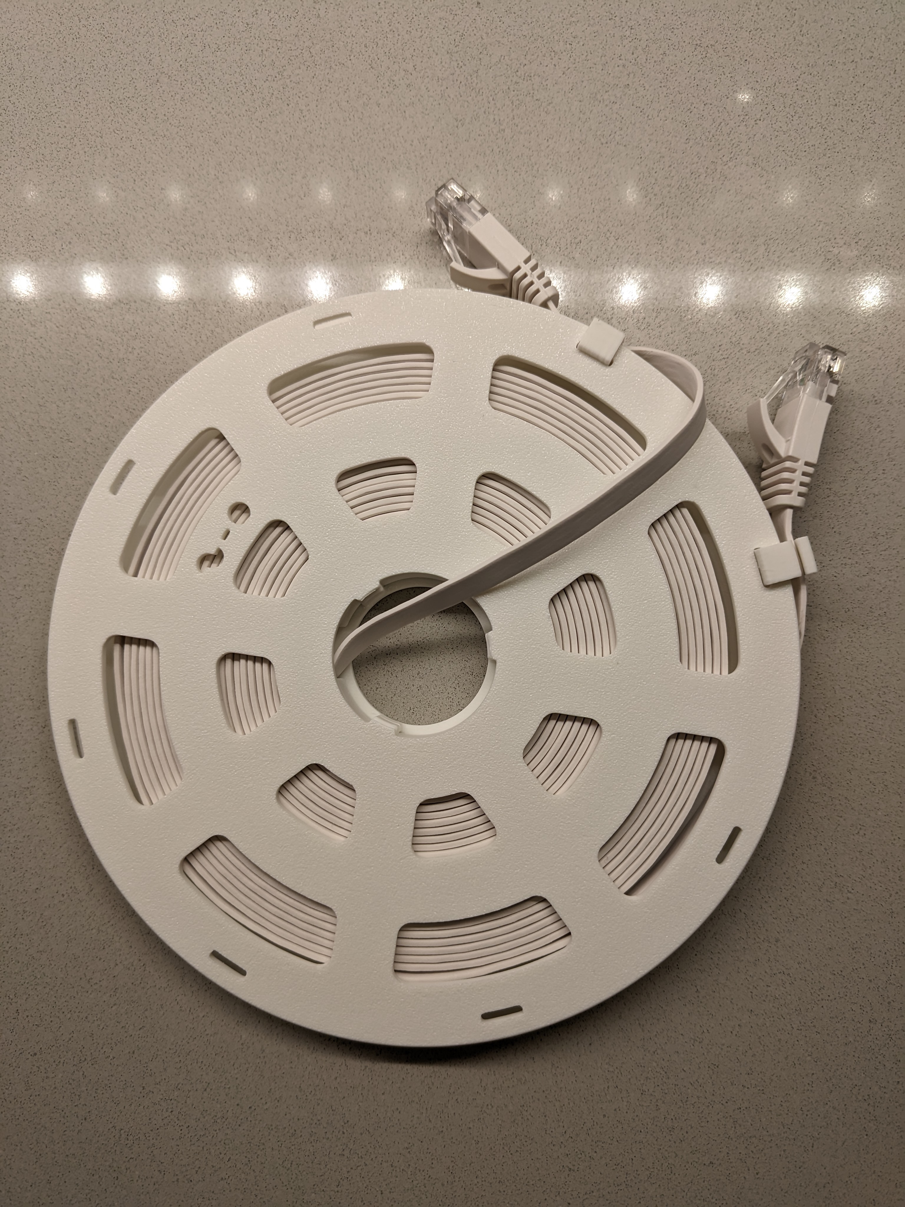 Flat ethernet cable spool with drill winding core