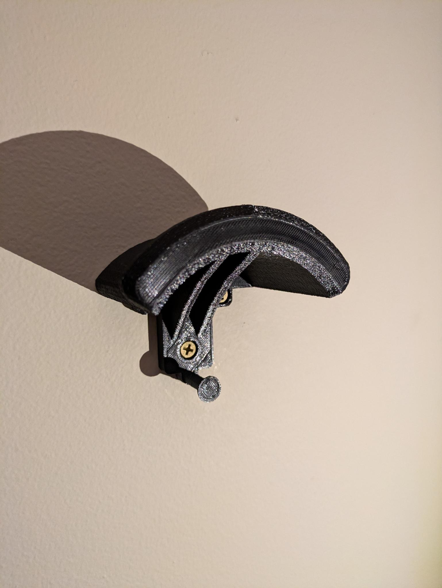 Motorcycle wall helmet holder