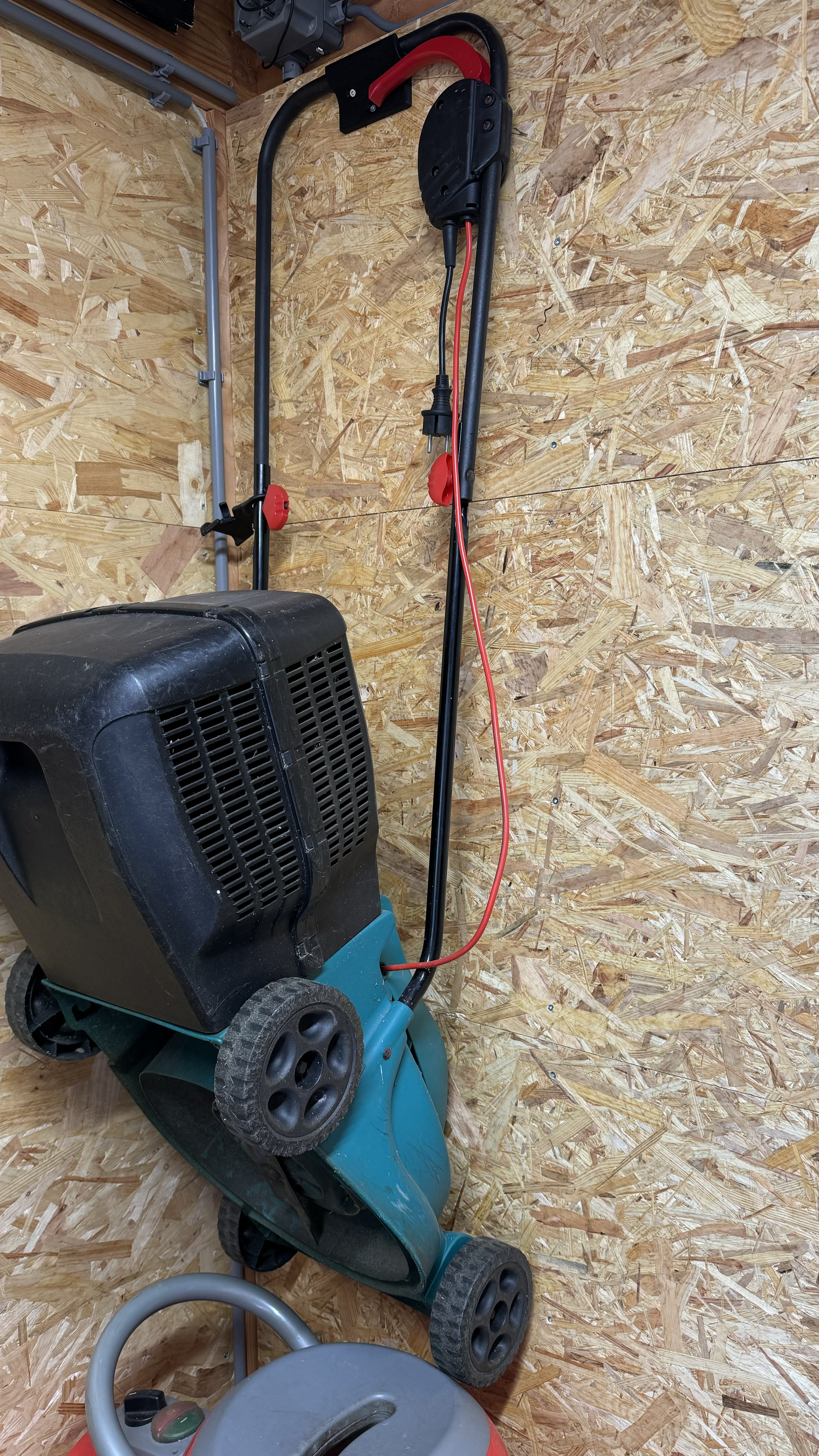 Electric lawn mower wall mount bracket
