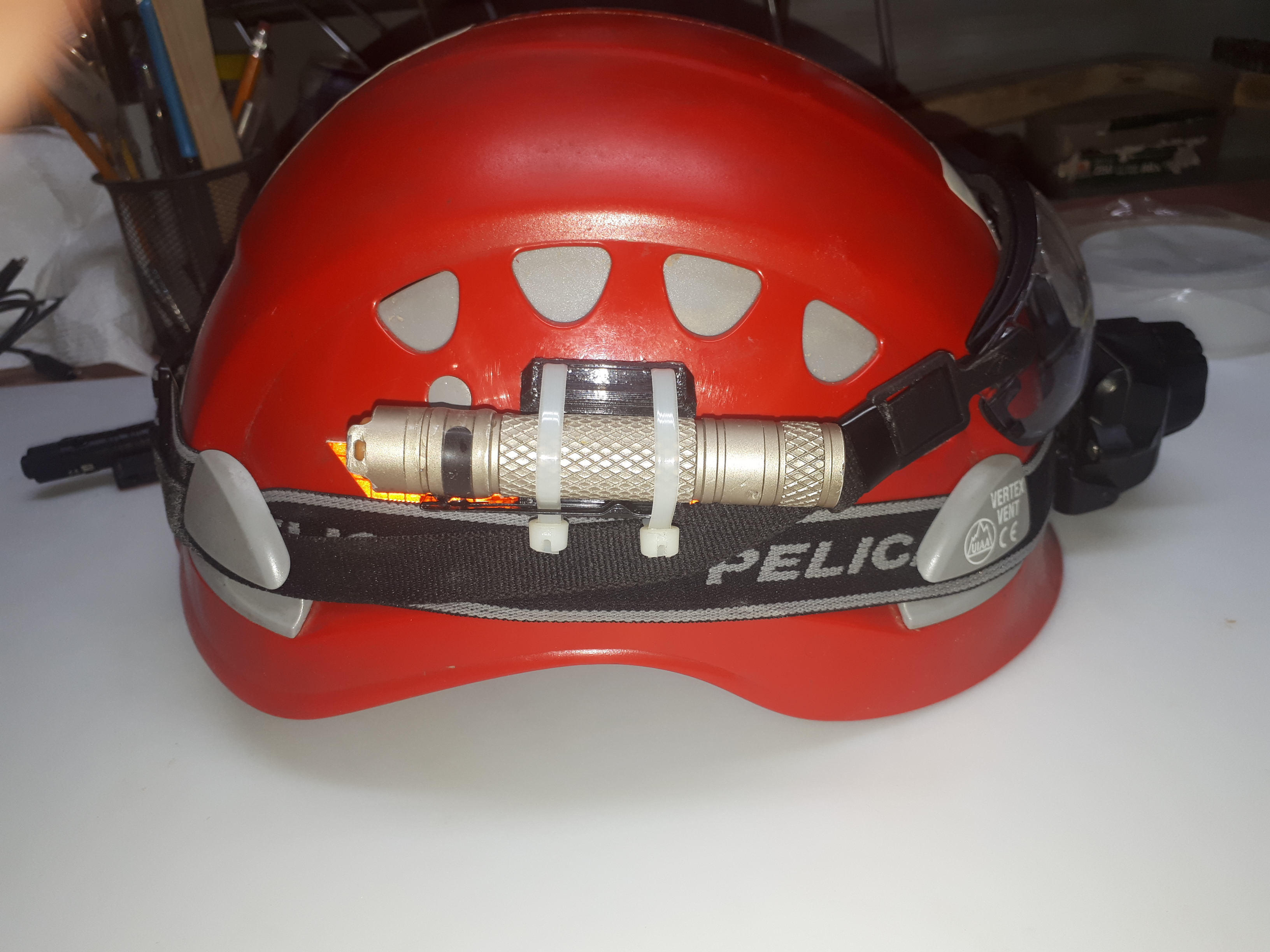 Flashlight mounts for Helmets or Straps