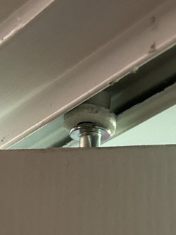 Bifold door pin roller