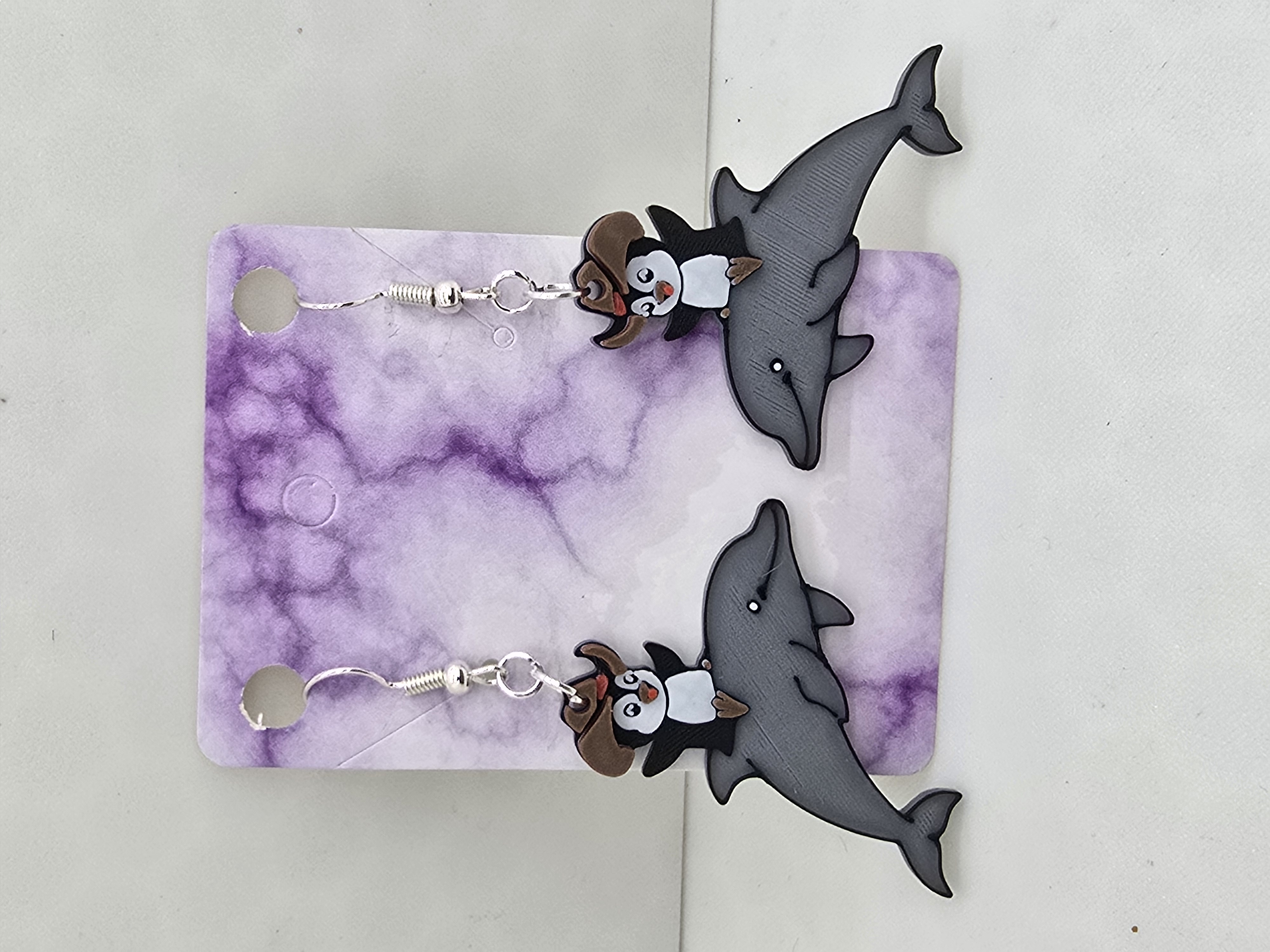 Penguin riding a dolphin Earrings
